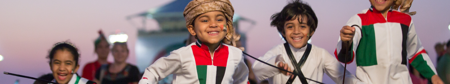 Kids enjoying UAE National Day festivities at