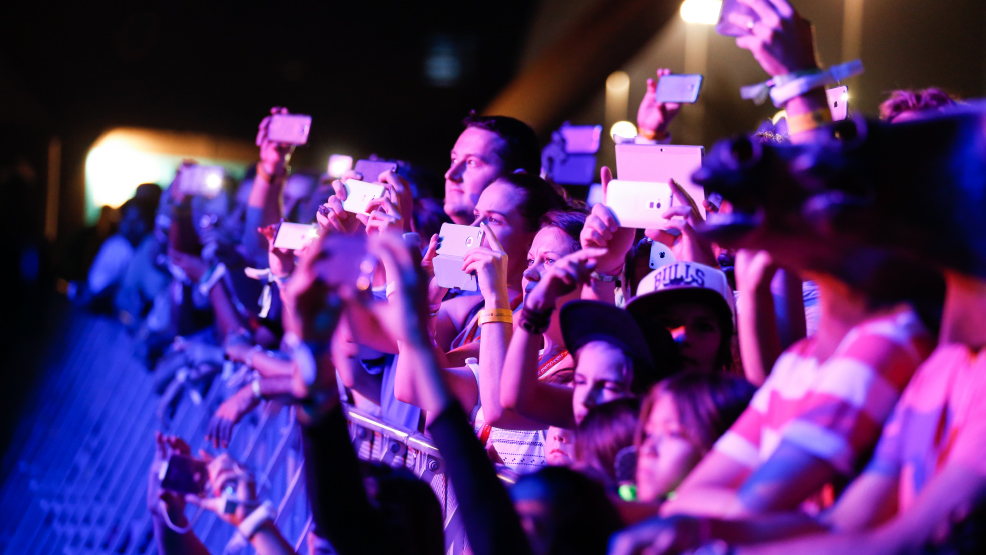 Close up of crowds watching a concert at du Arena